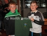 Matteo Melioli presenting Adian Mc Auley with his U11 North Antrim training top sponsored by Magill Meats and Sons Cloughmills
